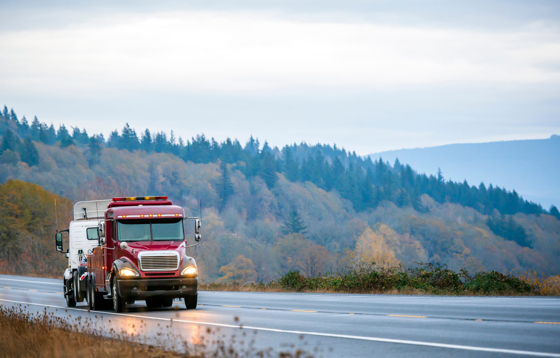 Truck on a scenic wet highway